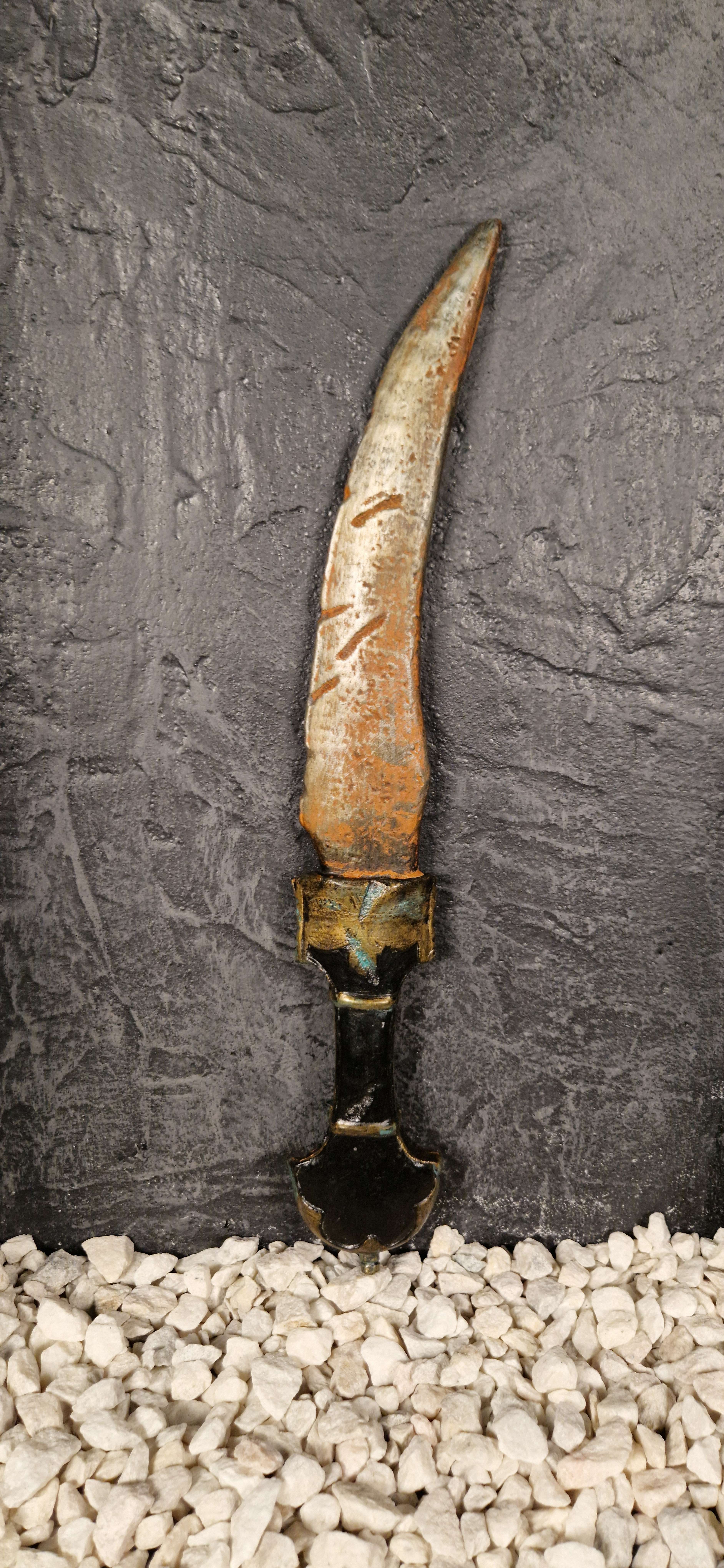 Oriental dagger covered in rust