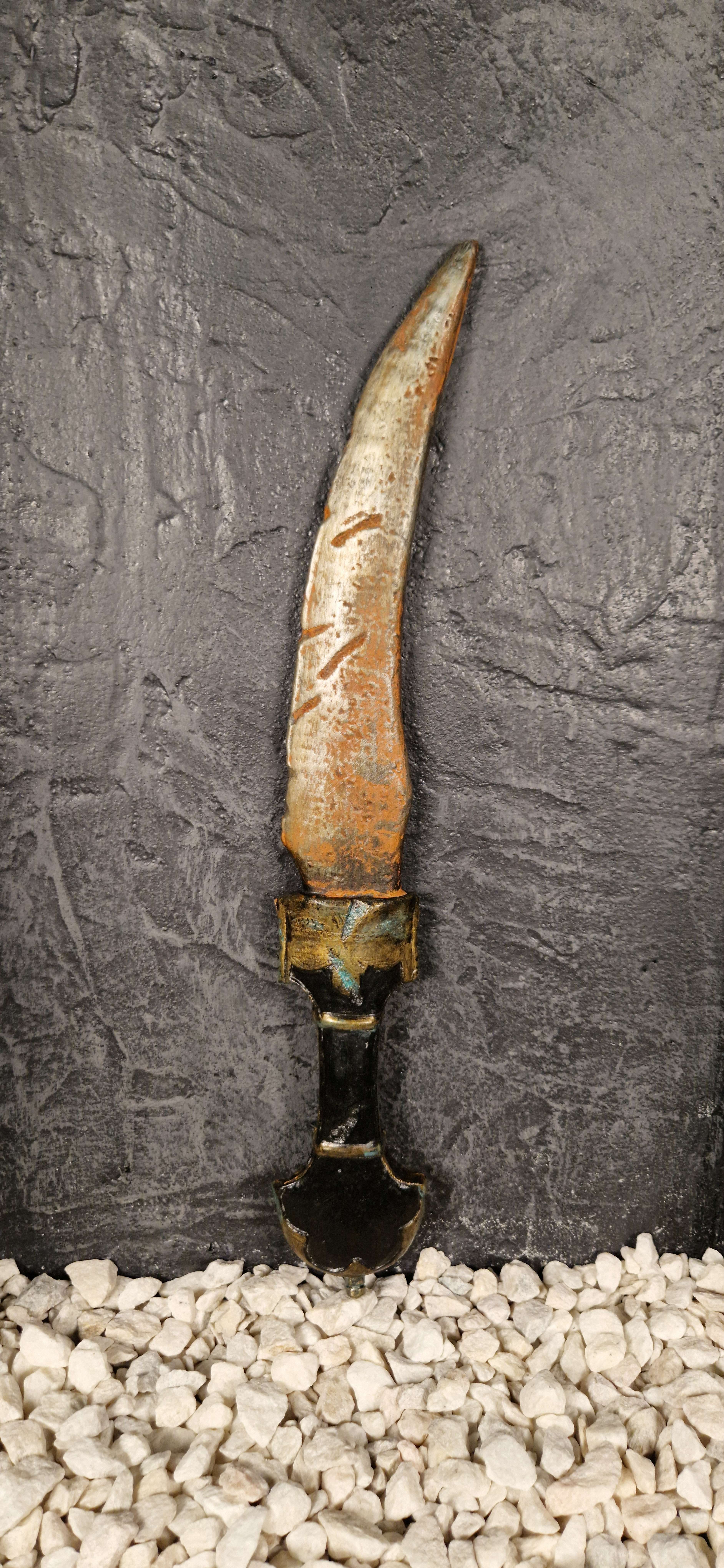 Oriental dagger covered in rust